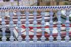 Casco Antiguo, Seville, Andalusia, Spain. Rowboats behind a ceramic banister at the canal. Art Print